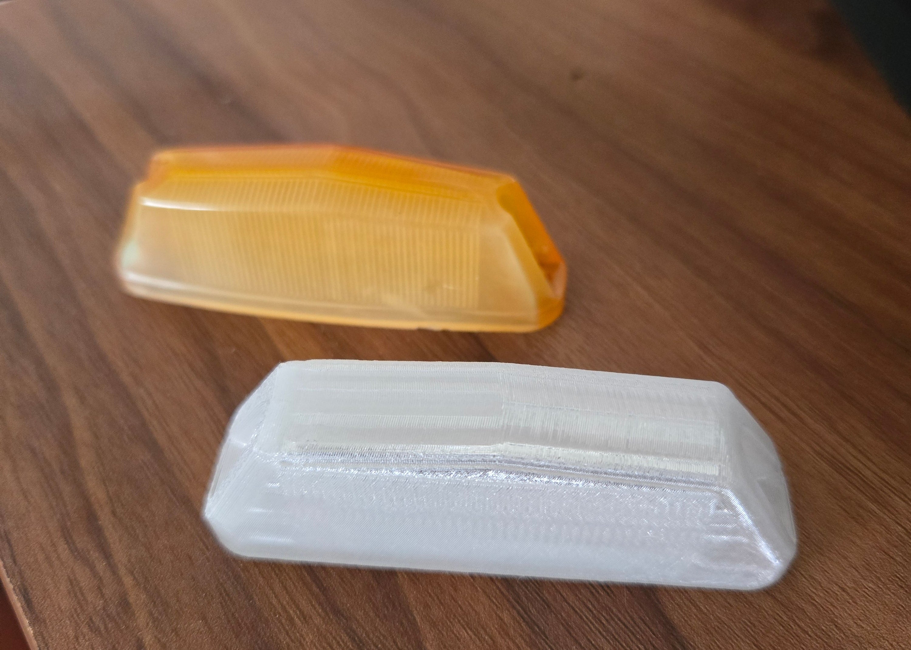 Two side indicators for a car, one modelled, one origianl. Both identical.